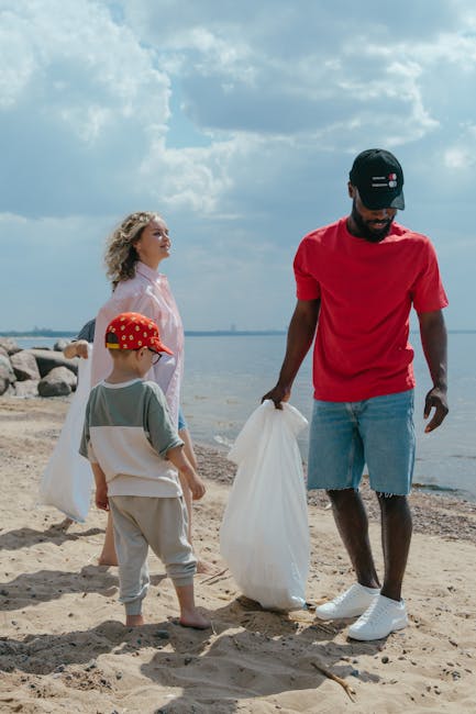 A patch of uneven ground covered with scattered waste materials, including torn cardboard boxes, crumpled paper, and broken packaging, primarily in shades of green, brown, and white. Some cardboard bo